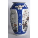 AN EARLY 20TH CENTURY JAPANESE MEIJI PERIOD PORCELAIN VASE painted with panels of foliage and vines.