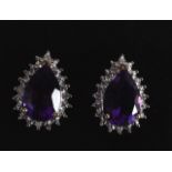 A PAIR OF 9CT GOLD PEAR SHAPED AMETHYST AND DIAMOND EARRINGS.