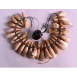 AN UNUSUAL TRIBAL CARVED TOOTH NECKLACE.