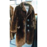 A LADIES BROWN FUR COAT