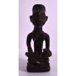 AN AFRICAN CARVED HARDWOOD FERTILITY FIGURE modelled as a female with breasts exposed. 8Ins high.