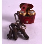 A LOVELY PAIR OF EDWARDIAN MINIATURE 'EROTIC' BINOCULARS inset with scenes of seduction. 0.75ins