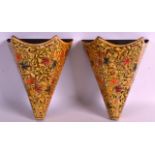 A PAIR OF KASHMIR LACQUER WALL POCKETS decorated with flowers. 6.5ins long.