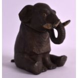 AN EARLY 20TH CENTURY FRENCH NOVELTY SPELTER INKWELL in the form of a seated elephant. 5.5ins high.