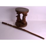 AN AFRICAN CARVED FIGURAL HARDWOOD STOOL together with a large carved tribal staff. (2)