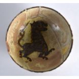 A Persian Yellow Ground Bowl Nishapur, 9th/10th Century, painted with a stylised lion. 8.25ins