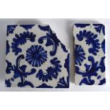Two 18th Century Turkish Blue and White Tiles, painted with flowers and scrolling vines. 7.25ins