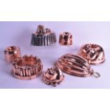 A GOOD COLLECTION OF VICTORIAN COPPER JELLY MOULDS in various forms and sizes. (qty)