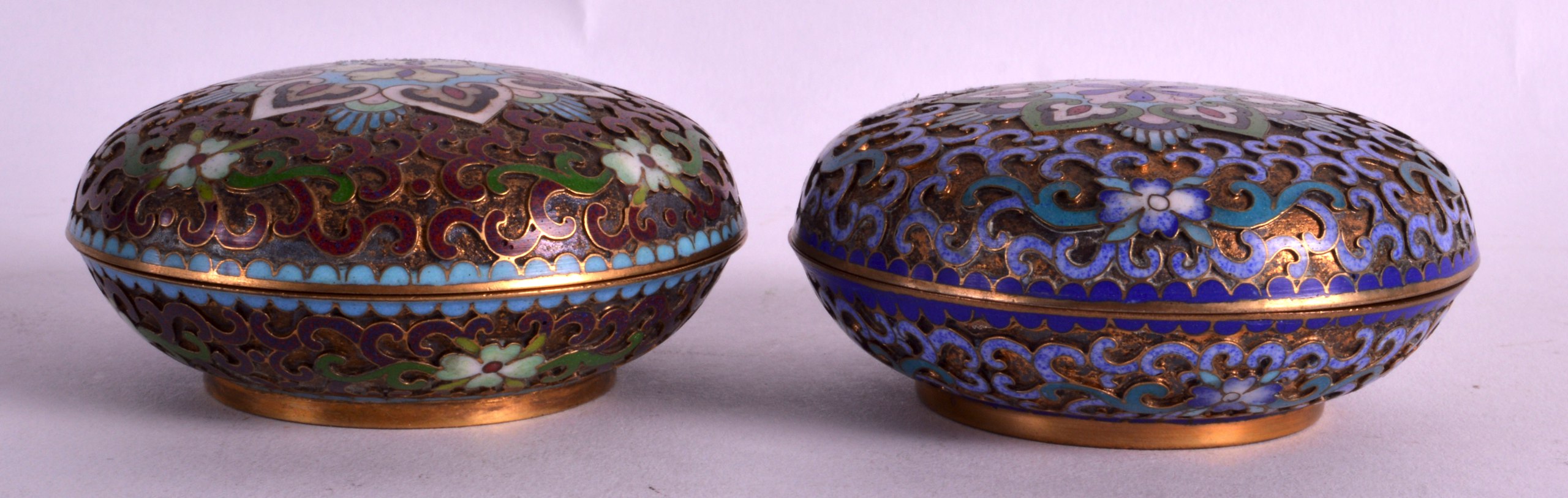 A PAIR OF EARLY 20TH CENTURY CHINESE CLOISONNE ENAMEL BOXES AND COVERS decorated with flowers. 3.