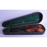 A CASED VIOLIN with two piece back and bow. 59 cm long. (2)