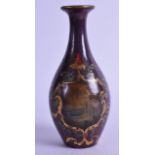 AN UNUSUAL VICTORIAN LACQUERED TIN VASE painted with a scene encased with foliage. 18.5 cm high.