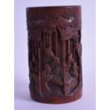 A LATE 19TH CENTURY CHINESE CARVED BAMBOO BRUSH POT decorated with figures amongst trees. 13.25 cm