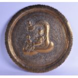 A 19TH CENTURY INDIAN EMBOSSED BRASS CHARGER decorated with two buddhistic figures, together with an
