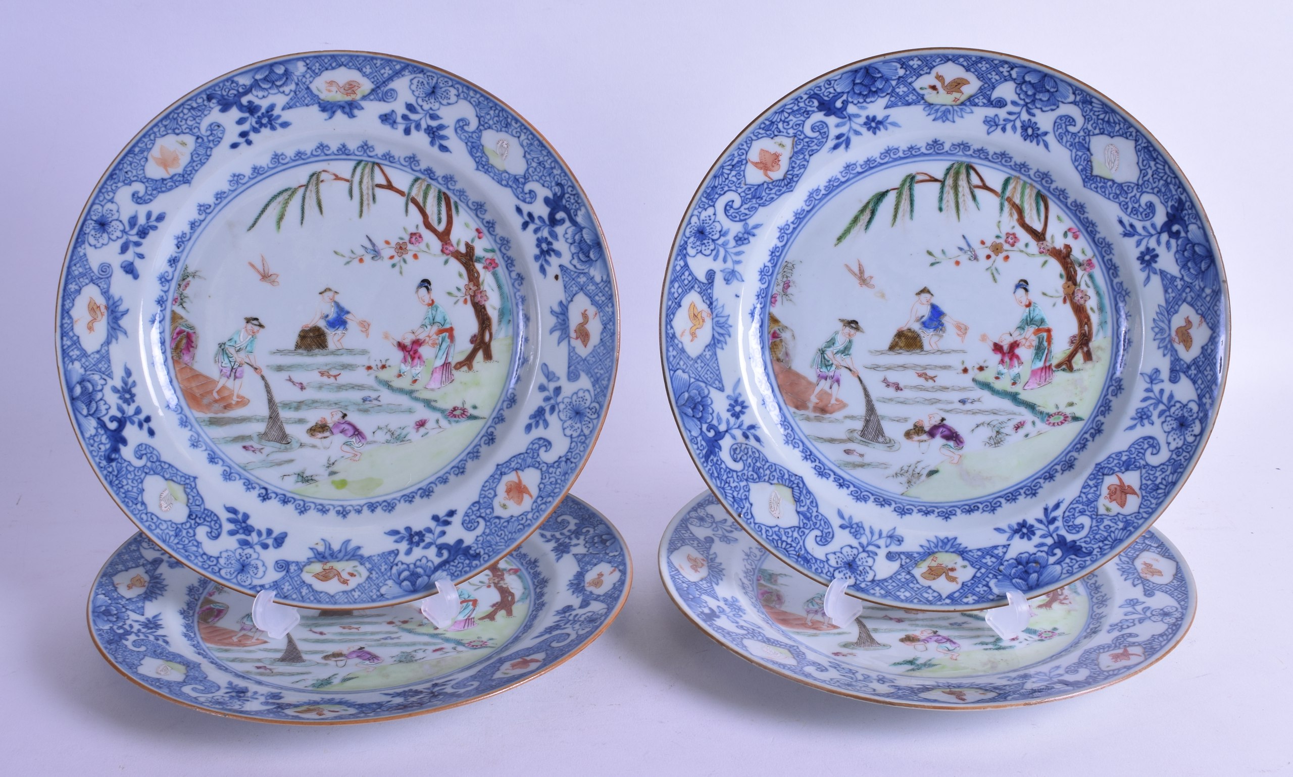 A SET OF FOUR 18TH CENTURY CHINESE EXPORT FAMILLE ROSE PLATES Qianlong, painted with figures fishing