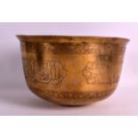 A GOOD PERSIAN/SYRIAN BRASS BOWL 10th/12th Century, incised with calligraphy and flowers. 8.75ins