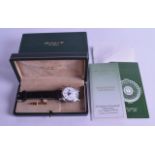 A GOOD BOXED ALFRED ROCHAT & FILS LES BIOUX GENTLEMANS SILVER WRISTWATCH with moonphase and date