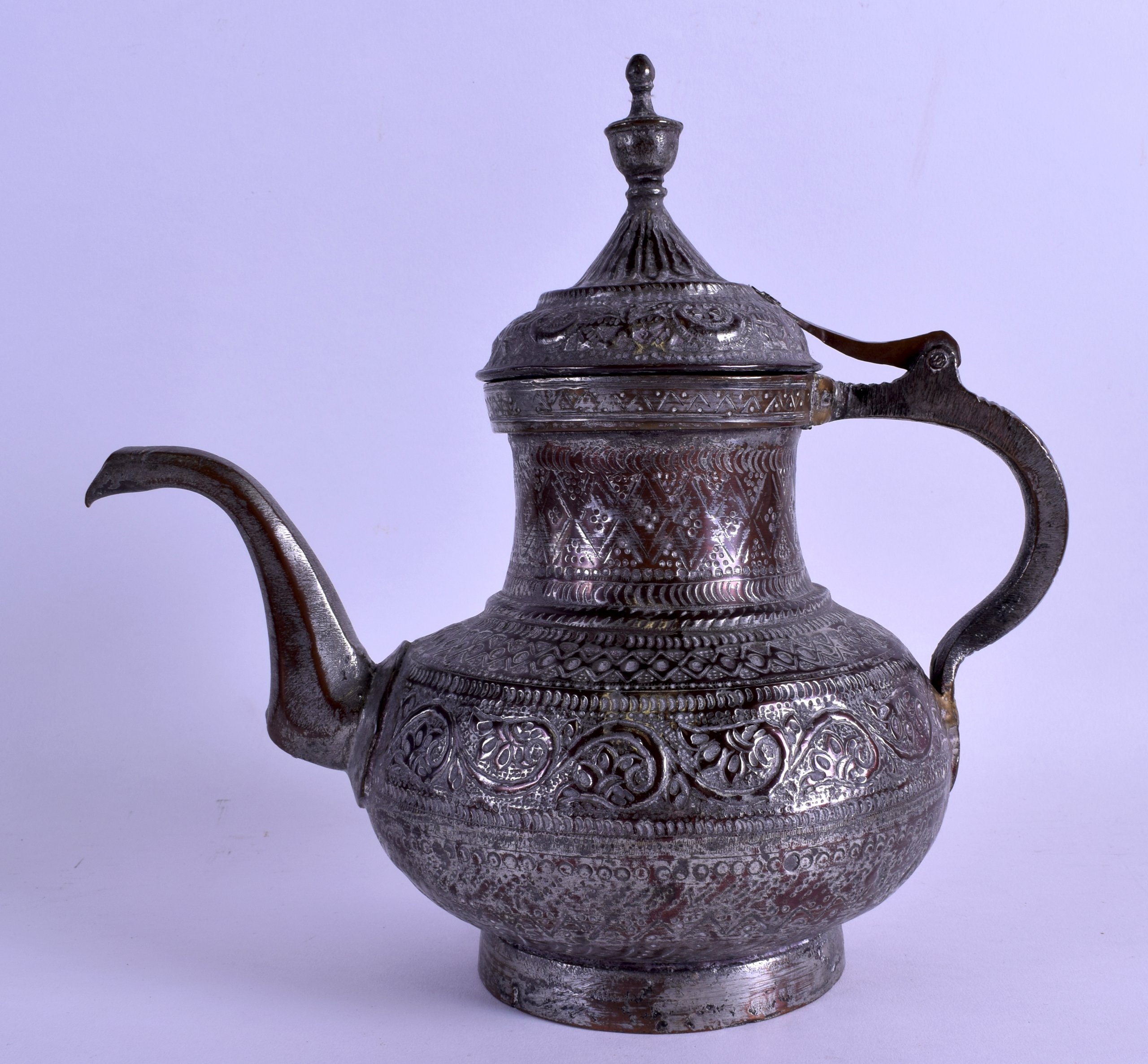 A LATE 19TH CENTURY INDIAN/PERSIAN MIXED ALLOY JUG decorated in relief with scrolling vines and