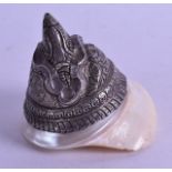 AN UNUSUAL 19TH CENTURY TIBETAN SILVER AND MOTHER OF PEARL CONCH SHELL formed as a central