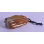 A 19TH CENTURY CHINESE CARVED MUTTON JADE PENDANT in the form of a fruiting pod. 6 cm long.