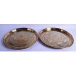 A PAIR OF HEAVY ANTIQUE INDO PERSIAN BRASS DISHES engraved with animals, lions, birds and foliage.