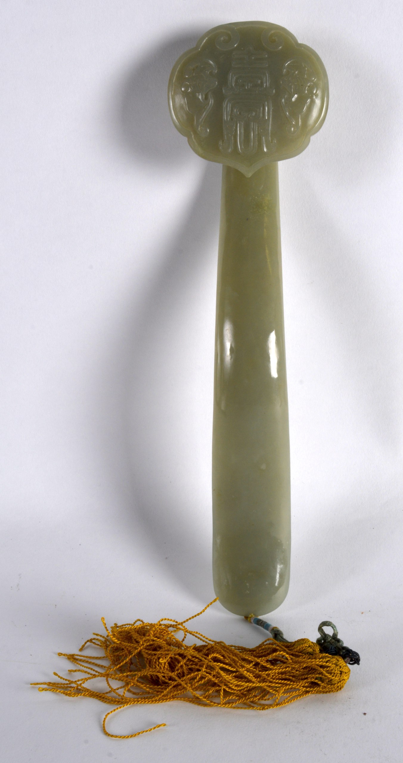 A CHINESE CARVED GREEN JADE RUI SCEPTRE decorated with bats and shou characters. 10.5ins long.