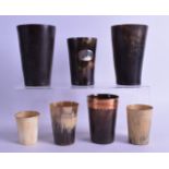 A SET OF SEVEN ANTIQUE HUNTING BEAKERS of various sizes. Largest 13.5 cm high. (7)