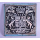 A PERSIAN/ARMENIAN BLACK AND WHITE TURQUOISE TONED TILE decorated with a crest, birds and stylised