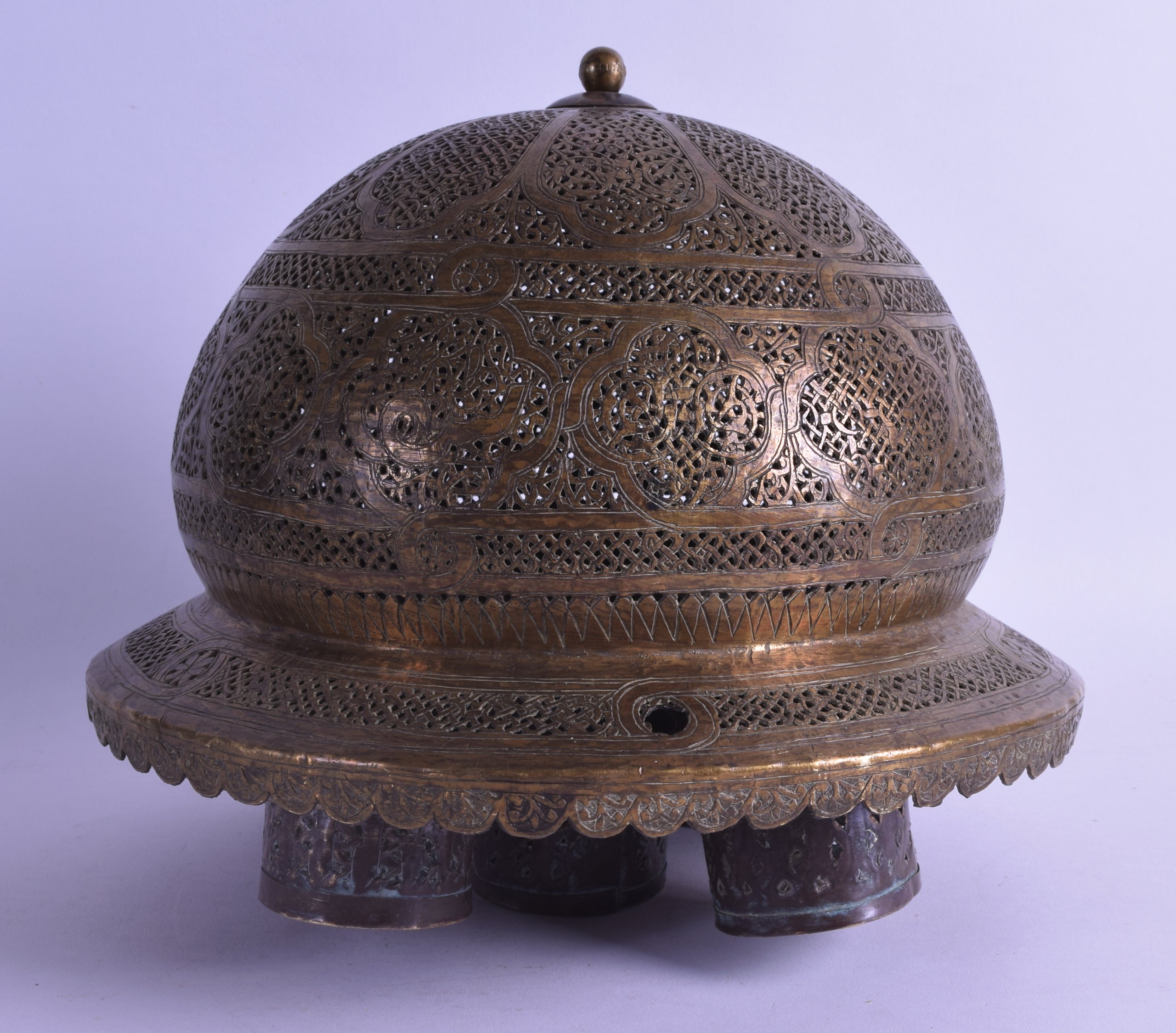 A 19TH CENTURY INDIAN/ISLAMIC PIERCED BRASS MOSQUE LANTERN decorated with foliage and motifs. 24