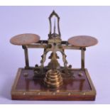 A PAIR OF LATE VICTORIAN/EDWARDIAN ENGRAVED BRASS SCALES. 17 cm wide.