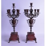 A PAIR OF LATE 19TH CENTURY FRENCH GILT SPELTER CANDLESTICKS. 51 cm high.