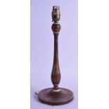 AN EDWARDIAN PAINTED WALNUT CANDLESTICK painted with flowers. 28 cm high.