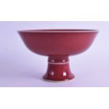 A CHINESE SANG DU BOEUF PORCELAIN STEM FOOT TAZZA bearing Qianlong marks to base. 17.5 cm high.