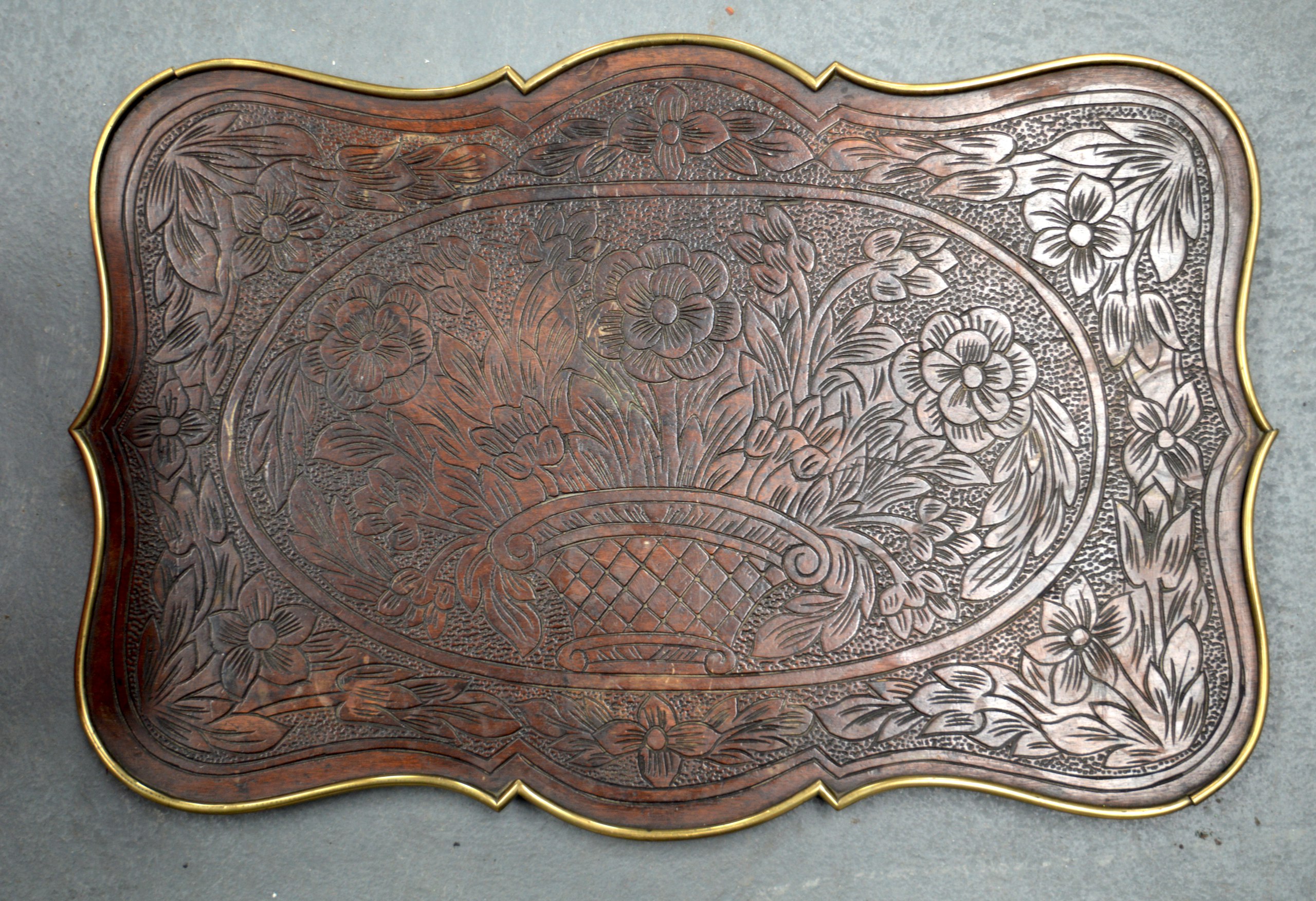 AN ANTIQUE CONTINENTAL BRASS MOUNTED WOODEN TRAY.