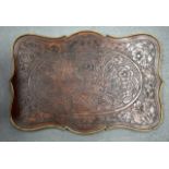 AN ANTIQUE CONTINENTAL BRASS MOUNTED WOODEN TRAY.