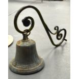 A LARGE ANTIQUE BRONZE BELL with iron supports.