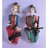 A PAIR OF EARLY 20TH CENTURY SOUTH EAST ASIAN WOOD FIGURES. 25 cm long.