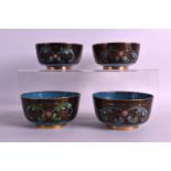 A SET OF FOUR EARLY 20TH CENTURY CHINESE CLOISONNE ENAMEL BOWLS decorated with foliage and scrolling
