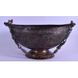 AN 18TH/19TH CENTURY INDIAN COPPER ALLOY BEGGING BOWL with ropetwist copper handle, decorated with