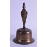 A 19TH CENTURY INDIAN BRASS BELL formed with two opposing figures. 20 cm high.