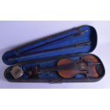 A CASED VIOLIN with two piece back and two bows. 59 cm long. (3)