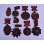 AN UNUSUAL COLLECTION OF NINE 1940S CHINESE BADGES & MEDALLION including Mao Democratic Hero Star