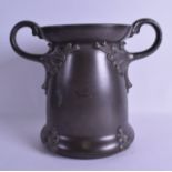 A LARGE ART NOUVEAU TWIN HANDLED PEWTER VASE in the manner of WMF, decorated in relief with a