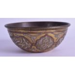 A 19TH CENTURY CAIROWARE SILVER AND COPPER INLAID BRASS BOWL decorated with stylised motifs. 12 cm