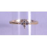 AN 18CT GOLD FOUR STONE DIAMOND RING.