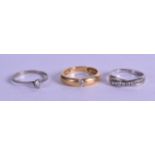 TWO GOLD AND DIAMOND RINGS together with another. (3)