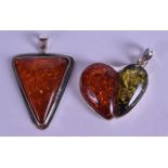 TWO SILVER AND AMBER PENDANTS. (2)