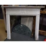 A GOOD LARGE ANTIQUE WHITE PAINTED FIRE SURROUND in the manner of Adams.