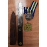 A WWI KNIFE, together with two medals. (3)