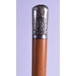 AN ANTIQUE SILVER MOUNTED REGIMENTAL MALLACA CANE the top decorated with The Essex Regiment crest.