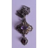 A VICTORIAN WHITE METAL AMETHYST AND GARNET FLORAL NECKLACE.